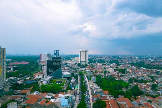 an aerial view of a city with tall buildings